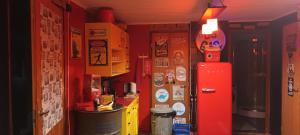 a room with a refrigerator and boxes on the wall at Pit Stop Gas Station in Lappeenranta