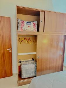 a cupboard with some shoes in it in a bedroom at Loano III - Confort Moderno en PB! in Belén de Escobar