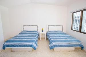 Ένα ή περισσότερα κρεβάτια σε δωμάτιο στο New Bamboo La Tropical +47 φωτογραφίες