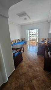 a room with beds and a tiled floor at La cassia in Cabo Negro