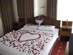 Ein Bett oder Betten in einem Zimmer der Unterkunft Antik Ridvan Hotel