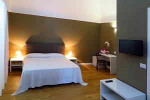 TV a/nebo společenská místnost v ubytování B&B In Centro