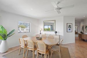 a dining room with a table and chairs at Coastal Luxury at 'Sunshine Central' 3 Bed Penthouse in Sunshine Beach +15 photos