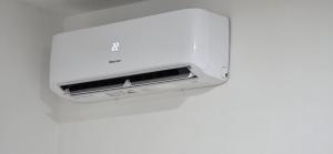 a white toaster hanging on a white wall at Riverstone Retreat Studio in Jajce