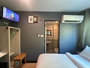 Postel nebo postele na pokoji v ubytování BBHouse Phra Athit + 4 fotografie