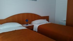 Postel nebo postele na pokoji v ubytování Guesthouse Storelli