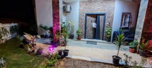 a house with potted plants in a yard at فيلا بجوار سينزو مول in Hurghada