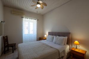 Postel nebo postele na pokoji v ubytování Mythos Suites-Aphrodite apartment