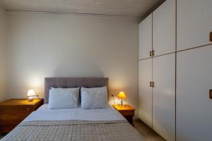 Postel nebo postele na pokoji v ubytování Mythos Suites-Aphrodite apartment