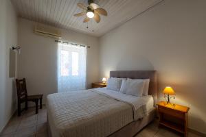 Postel nebo postele na pokoji v ubytování Mythos Suites-Aphrodite apartment