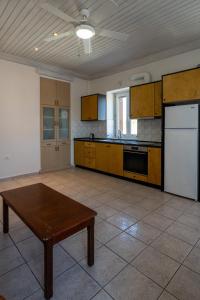 Kuchyň nebo kuchyňský kout v ubytování Mythos Suites-Aphrodite apartment