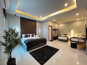 Ένα ή περισσότερα κρεβάτια σε δωμάτιο στο La Villa Pool Krabi +26 φωτογραφίες