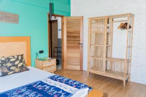 Postel nebo postele na pokoji v ubytování Mantra Yoga Homestay