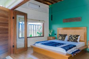 Postel nebo postele na pokoji v ubytování Mantra Yoga Homestay