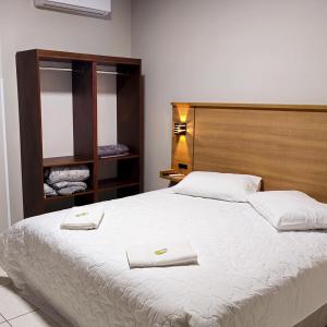 Ένα ή περισσότερα κρεβάτια σε δωμάτιο στο House Hotel e Restaurante