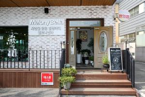 a storefront of a bakery with a door at Mungang Hot Springs Hotel in Chungju