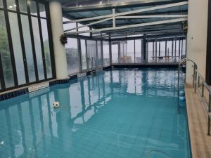 a large swimming pool with a ball in the water at Yangpyeong Blue Hill Pension in Yangpyeong