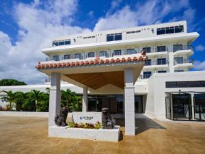 a hotel with a large white building at Lit Hotel NAKIJIN in Nakijin +116 photos