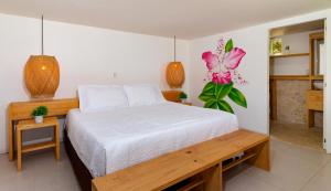 Postel nebo postele na pokoji v ubytování Hotel Arena Beach Cartagena