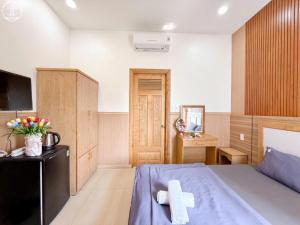 Postel nebo postele na pokoji v ubytování Nova Hotel Vũng Tàu