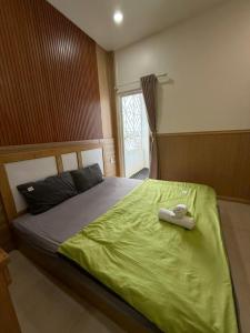 Postel nebo postele na pokoji v ubytování Nova Hotel Vũng Tàu