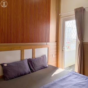 Postel nebo postele na pokoji v ubytování Nova Hotel Vũng Tàu