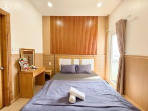 Postel nebo postele na pokoji v ubytování Nova Hotel Vũng Tàu