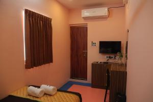 TV/trung tâm giải trí tại Le Apex Tharavaadu