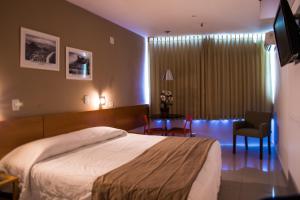 Кровать или кровати в номере Atlantis Copacabana Hotel