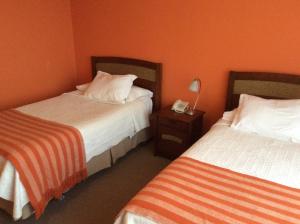 Postel nebo postele na pokoji v ubytování Hotel Patagonia Insular