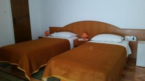 Postel nebo postele na pokoji v ubytování Guesthouse Storelli