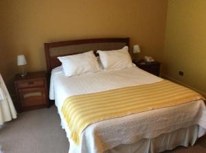 Postel nebo postele na pokoji v ubytování Hotel Patagonia Insular