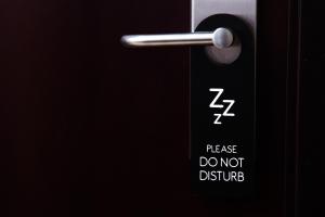 a close up of a doorhandle with the words please dont disturb at Hotel HAUS Ixtaczoquitl&aacute;n in Orizaba