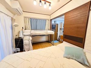 a hospital room with a bed and a window at 302Near Ueno Heart of city in Tokyo