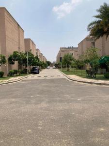 an empty street in front of a building at Luxury & Peaceful stay in Omaxe in Vrindāvan +3 photos