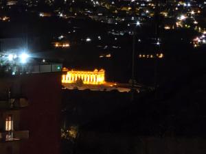 a building lit up at night with lights at Amuri Holiday Home in Agrigento