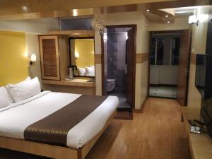 Darshan Hotel客房内的一张或多张床位