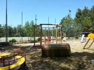 an empty playground with a swing set in a park at Agriturismo Fara del Falco in Vieste