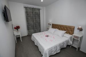 Posteľ alebo postele v izbe v ubytovaní Hostal Boutique Bajamar