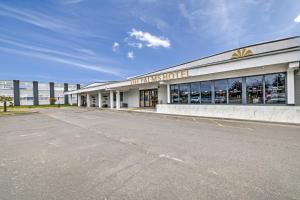 a building with a sign on the front of it at Palms Hotel & Retreat By Palette London Romford in Hornchurch