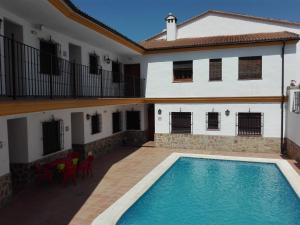 a swimming pool in the courtyard of a house at Casa Dominga in El Bosque