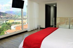 Postel nebo postele na pokoji v ubytování Arame Hotel