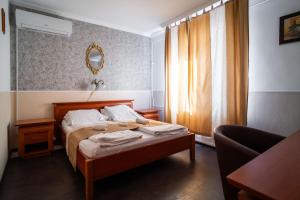 Postel nebo postele na pokoji v ubytování Ambrózia Szálláshely és Étterem
