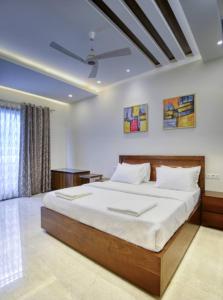 a bedroom with a large bed in a room at Royal escape in Gurgaon