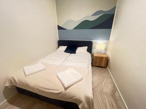 Postel nebo postele na pokoji v ubytování Apartament Hampton przy plaży - Etezje Apartamenty
