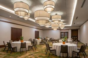 a conference room with tables and chairs and chandeliers at The Tallison Hotel, a Tribute Portfolio Hotel in Carmel +17 photos