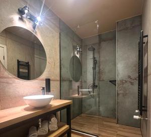 a bathroom with a sink and a shower at MYAPPARTEMENT ll in Künzelsau