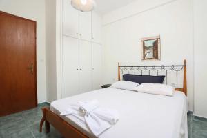 En eller flere senge i et værelse på Villa Garden