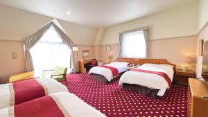 Postel nebo postele na pokoji v ubytování Hotel Floracion Nasu + 37 fotografií