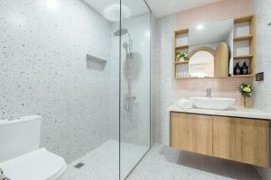 a bathroom with a toilet and a sink and a shower at Label6 To Ngoc Van - Crescendo Boutique Studio in Hanoi +76 photos